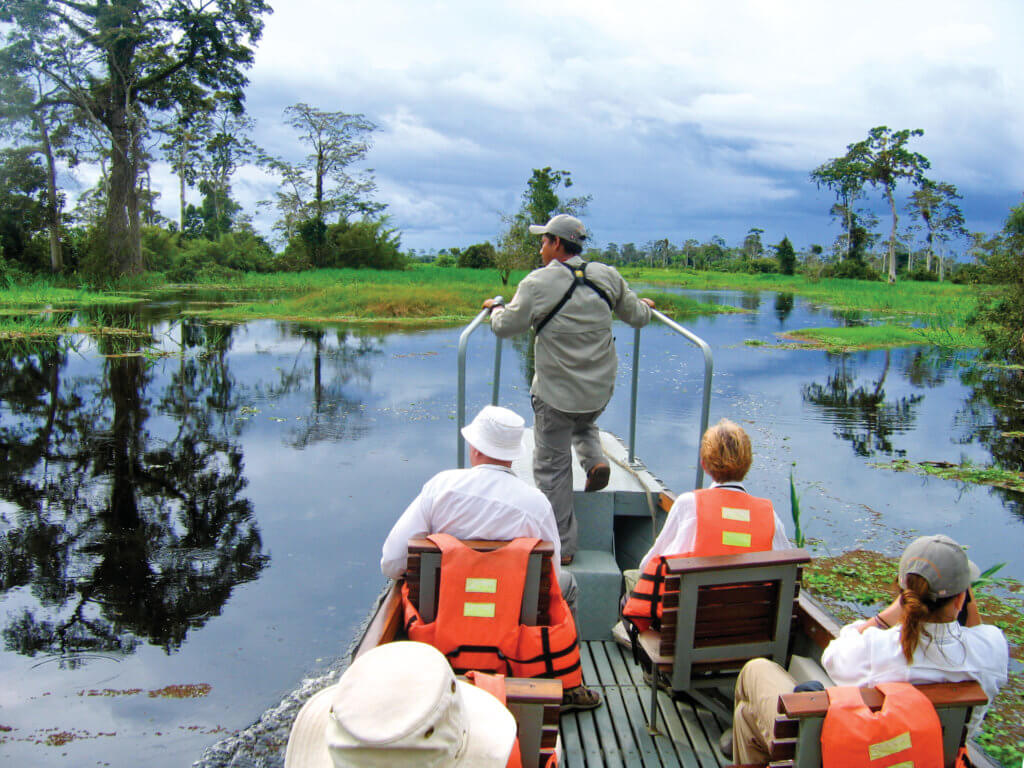 Guide leading passengers exploring the Amazon