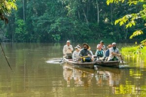 Guests in row boats exploring the Amazon