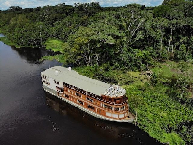 Delfin II docked along the shore