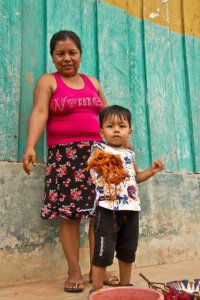 Woman with child holding handicrafts